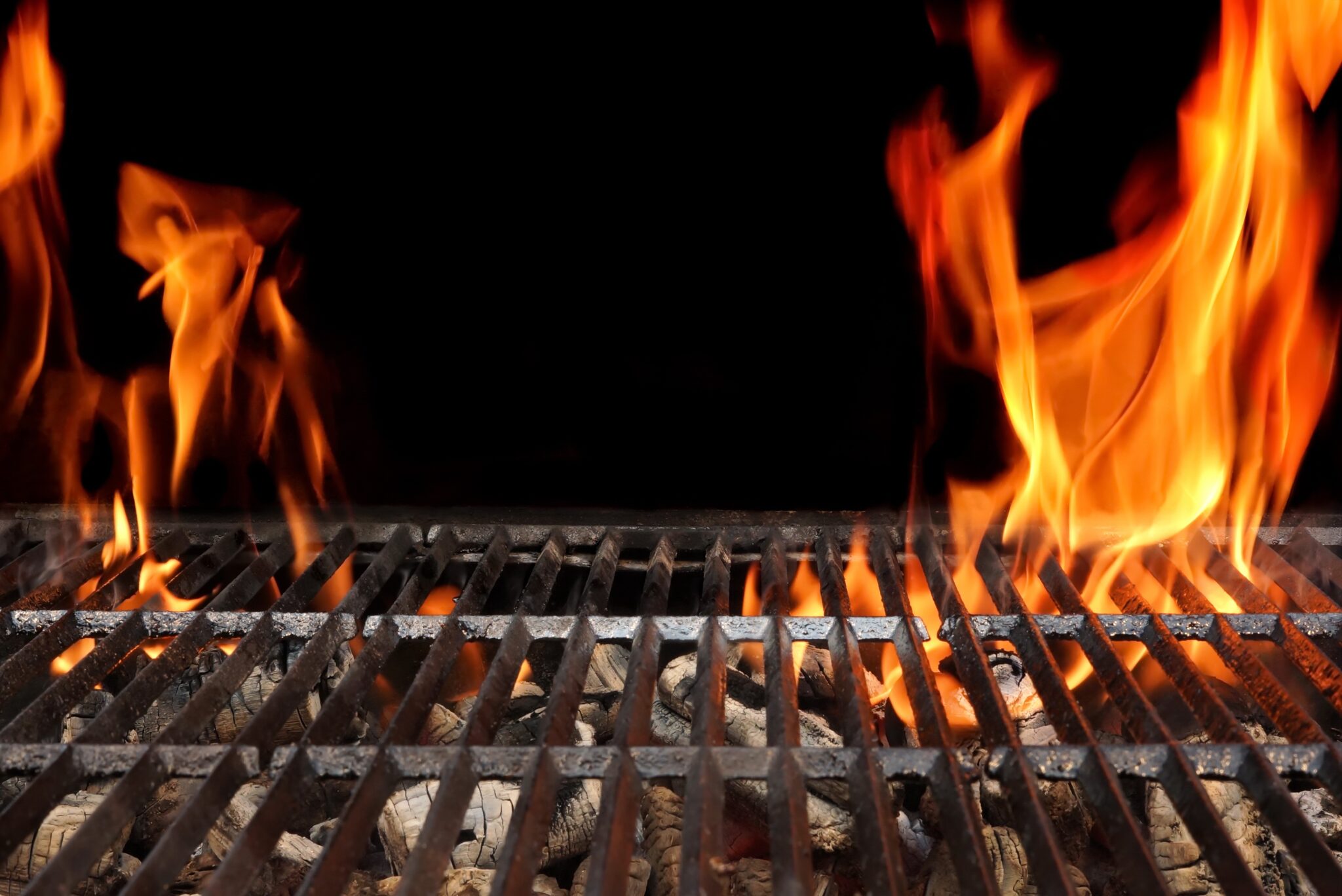 Empty Barbecue Grill With Bright Flames Closeup - Somagic.gr